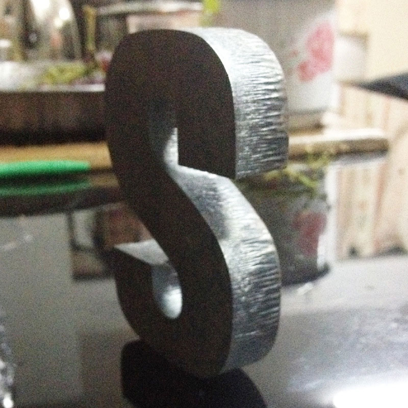 Laser engraving S letters