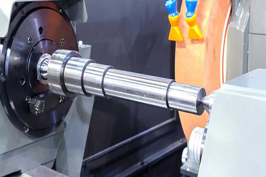 How does the axle affect the performance of a precision grinder